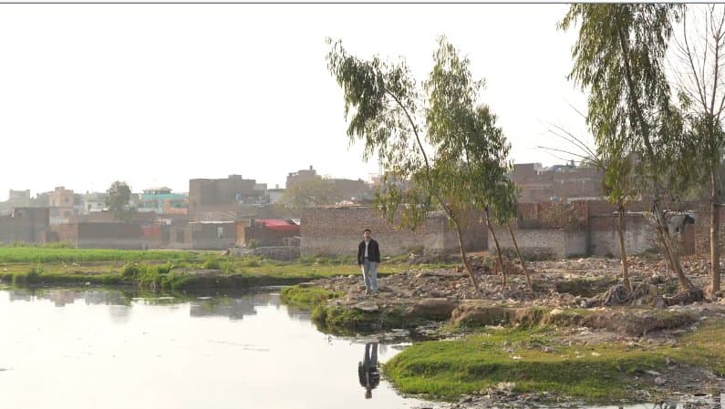 Field researcher reviewing climate data in documentary style